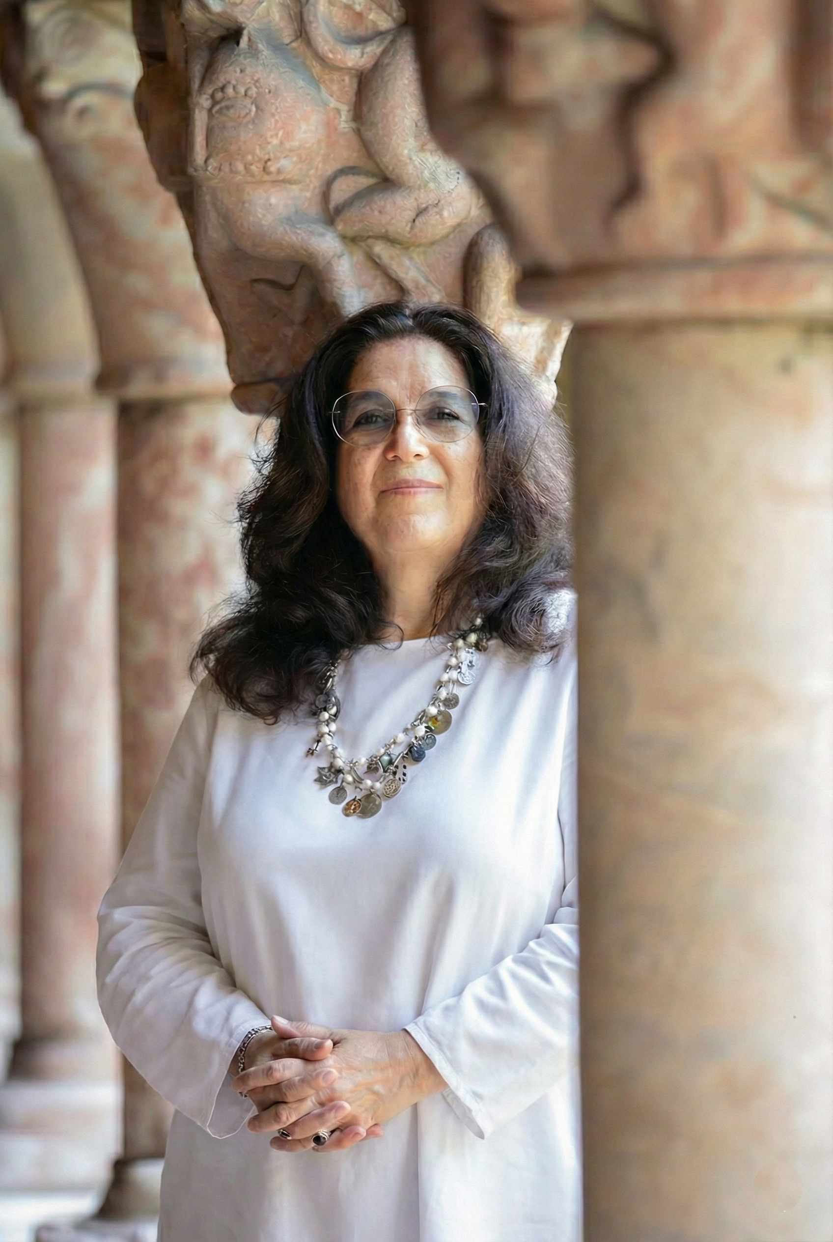 Picture of Judith Adler standing by the pillars at the Cloisters a division of the The Metropolitan Museum of Art in New York